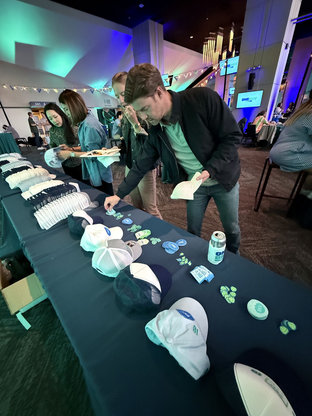 Guests watching custom merch get printed live at a Indianapolis event